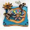 Magnetic spinner art with bees and flowers.